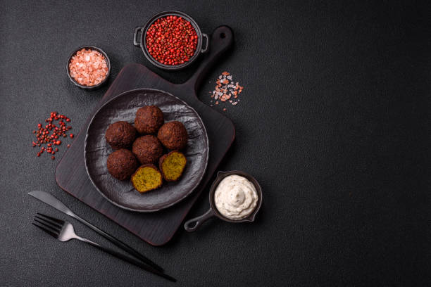 istock Fried chickpea falafel balls with salt, spices and herbs 2192702369