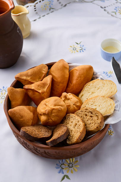 istock Rustic Bread Basket and Assorted Pastries in Warm Natural Light 2192702757