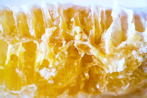 istock Close-Up of Golden Honeycomb Structure 2192704049