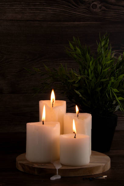 istock atmosphere, photography, candle, tradition, burning, relaxation, decor, close-up, candlelight, table, flame, aromatherapy, decoration, ceremony, interior, spa, romantic, night, wax, dark 2192707733
