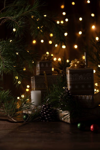 istock Captivating Scene with Holiday Decorations Featuring Wrapped Presents, Pine Branches, Pinecones, and Festive Fairy Lights Evoking Seasonal Warmth and Joyful Atmosphere 2192707747