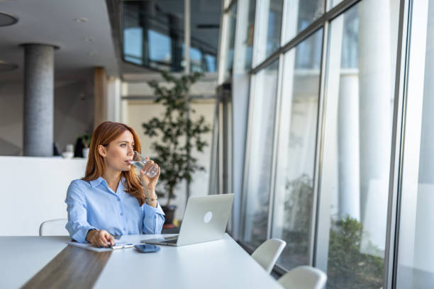 Businesswoman taking a refreshing break at her desk