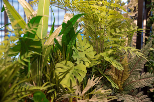 istock Artificial lush indoor plant arrangement with a mix of greenery 2192715355