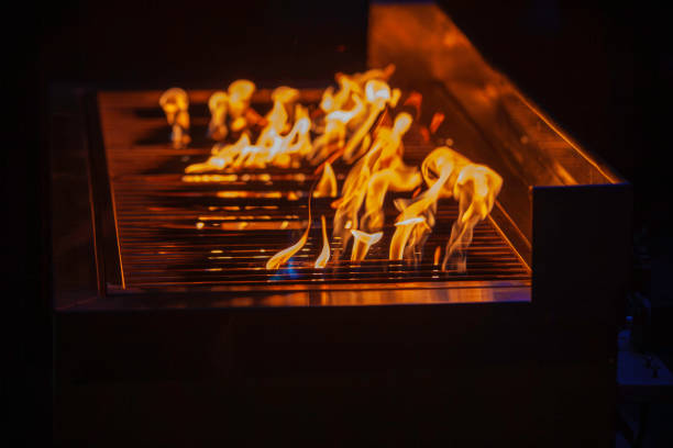 istock Vivid Flames on BBQ Grill with Intense Yellow Fire Up 2192715762