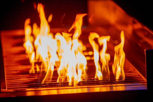 istock Vivid Flames on BBQ Grill with Intense Yellow Fire Up 2192715775