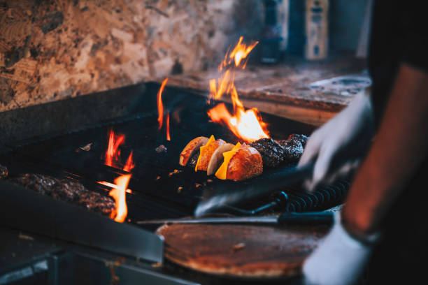 istock Grilling Burgers Over Open Flame with Melted Cheese 2192715782