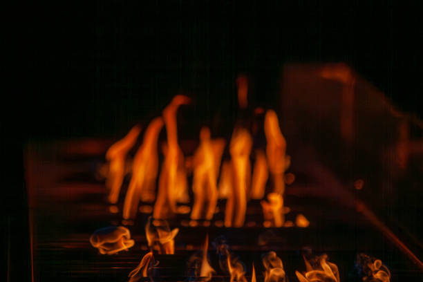 istock Vivid Flames on BBQ Grill with Intense Yellow Fire 2192715791