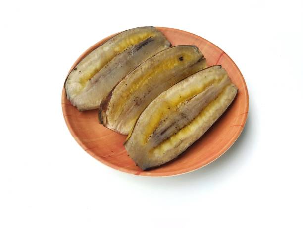 istock Steamed banana on plate isolated on white background 2192718412