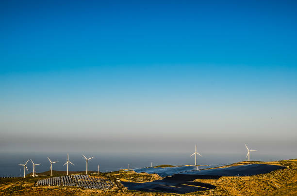 istock A wind farm with several wind turbines is visible in the distance 2192718627