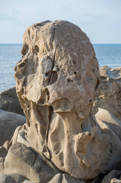 istock Wind-eroded rocks illuminated by the sun in the beautiful Punta Molentis beach in Villasimius 2192719211