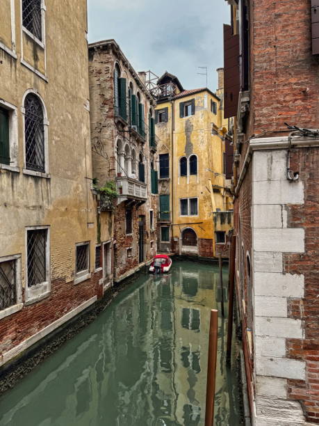 Exploring the Tranquil Canals of Venice, Italy, While Enjoying Serene Reflections in 2024
