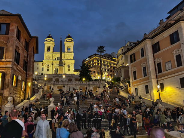 Crowd Gathering at the Spanish Steps in Rome During Evening Hours in 2024