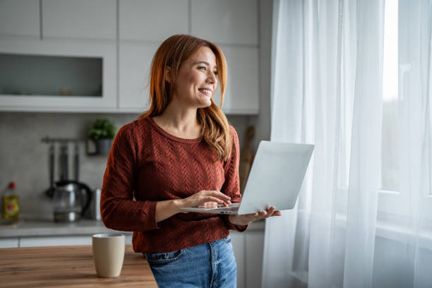 istock Beautiful woman working on her laptop 2192727506