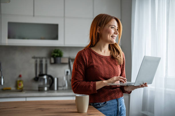 istock Beautiful woman working on her laptop 2192727510