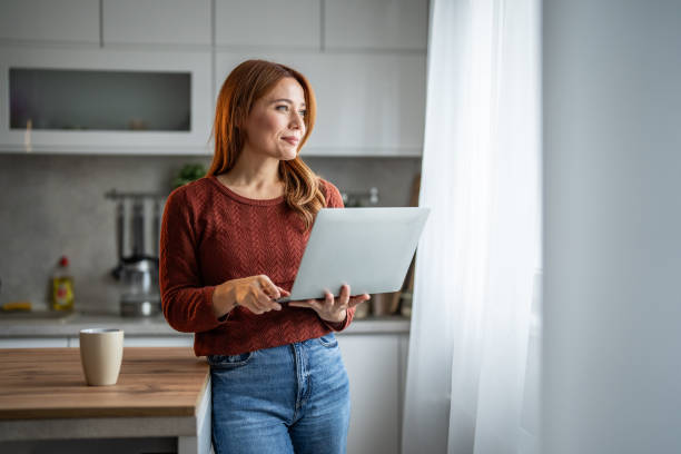 istock Beautiful woman working on her laptop 2192727519