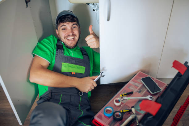 istock Portrait of a professional plumber in work attire fixing a kitchen pipe. 2192729609