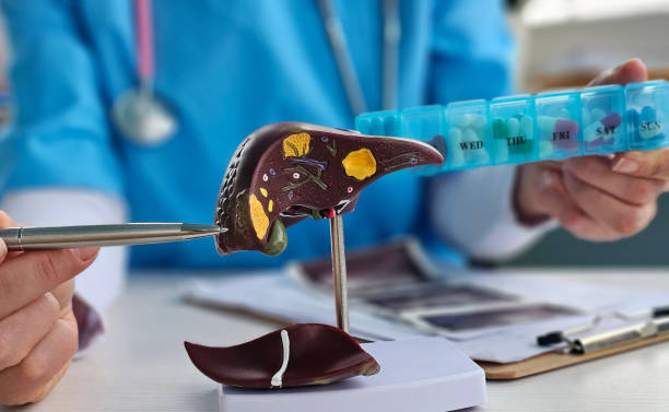 istock Liver problem with colorful medical pills closeup 2192730030