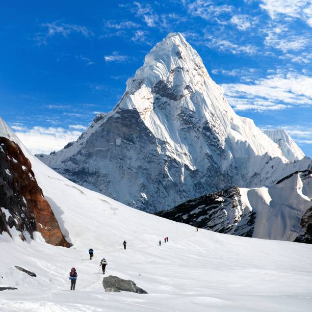 istock hikers on glacier and mount Ama Dablam 2192730259