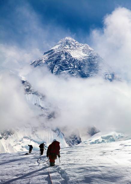 istock montage of three hikers on glacier and mount Everest 2192730481