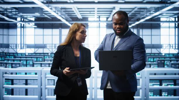istock Admin greeting inspector arriving in data center to supervise operations 2192730614