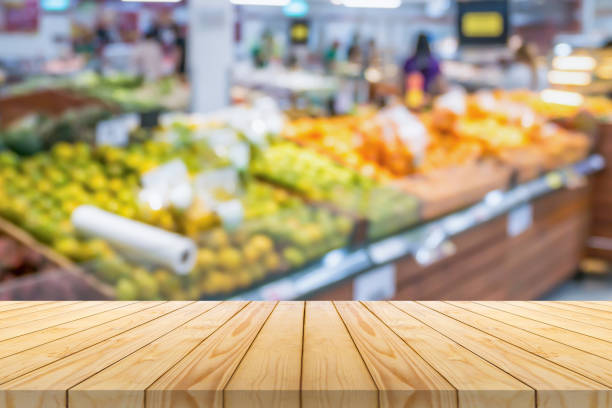 istock Empty wood table top with supermarket blurred background for product display 2192737176
