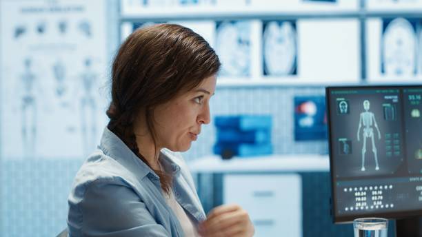 istock Doctor reading x ray imaging for a diagnostic report at consultation 2192738559
