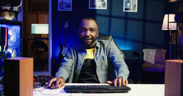 istock Joyous gamer competing in intense internet multiplayer videogame 2192740612