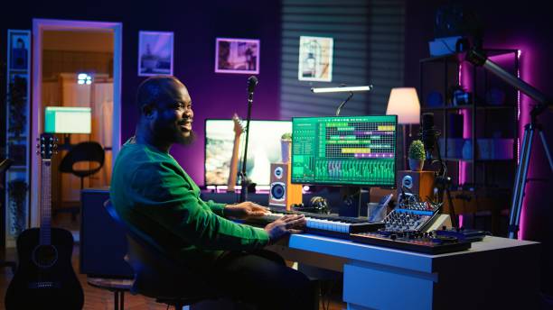 istock Musician playing piano keyboard and recording tracks for mix and master session 2192741013