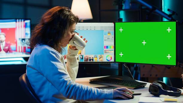 istock Content specialist making social media post on green screen PC 2192741270