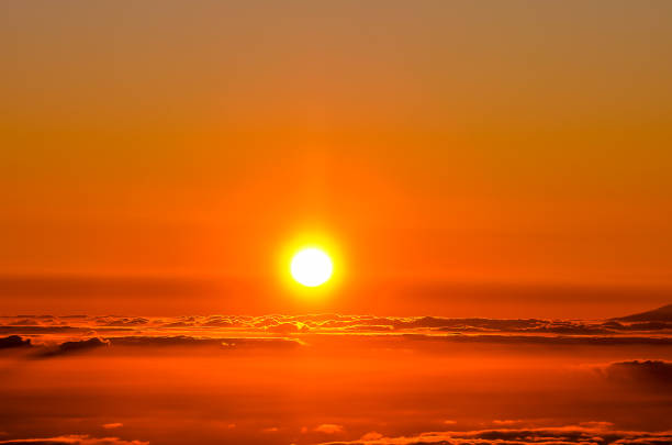 istock The sun is setting over the ocean, casting a warm glow over the water 2192741480