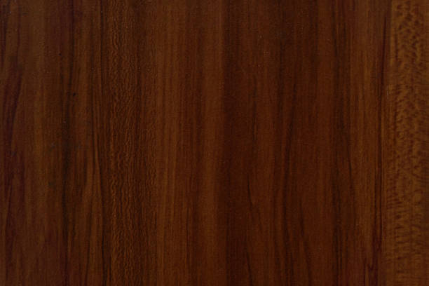 istock A dark brown wood grain pattern with vertical lines, creating a textured and natural background surface. 2192743646