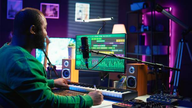 istock Songwriter taking notes to create new tracks for an album in his home studio 2192744280