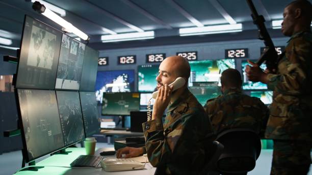 istock Military officer receiving telephone call while looking at intel files 2192744736