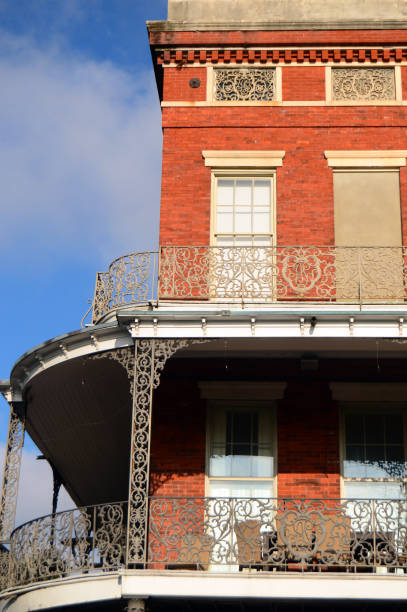 October 29 Intricate iron work wraps around a curved balcony at a building in the French Quarter of New Orleans