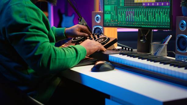 istock Skilled music producer composing new soundtracks on console and daw software 2192748256