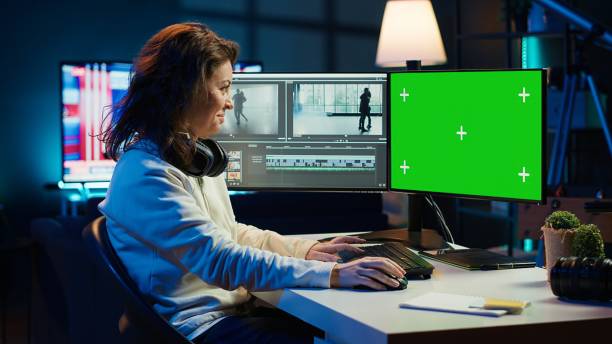 Woman using professional software on mockup PC to create visual effects Woman using professional software on mockup PC to create visual effects for video projects. Specialist using post production techniques to edit raw clips footage on green screen computer, camera A female film editor stock pictures, royalty-free photos & images