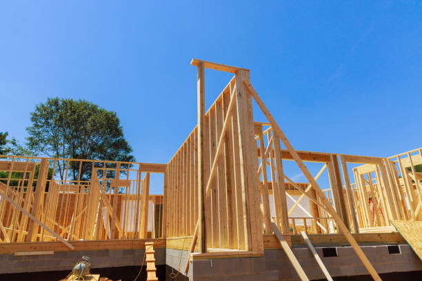 istock Construction project underway for a wooden structure with clear blue skies overhead in a residential area 2192750469