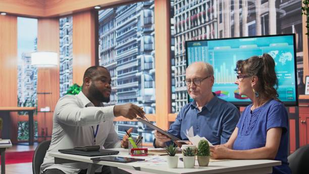 istock Senior clients asking a financial advisor about various retirement options 2192753157