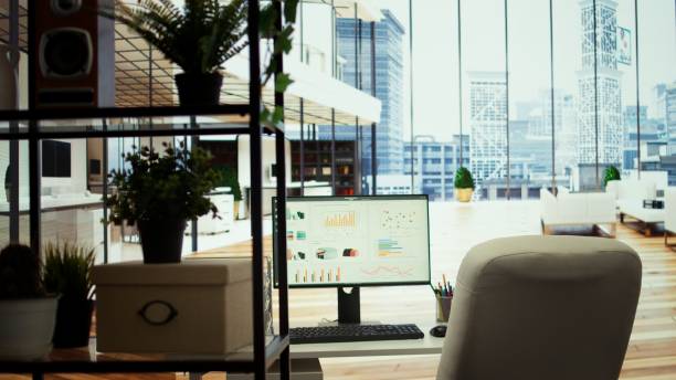 istock High end company office with a computer showing detailed data insights 2192753586