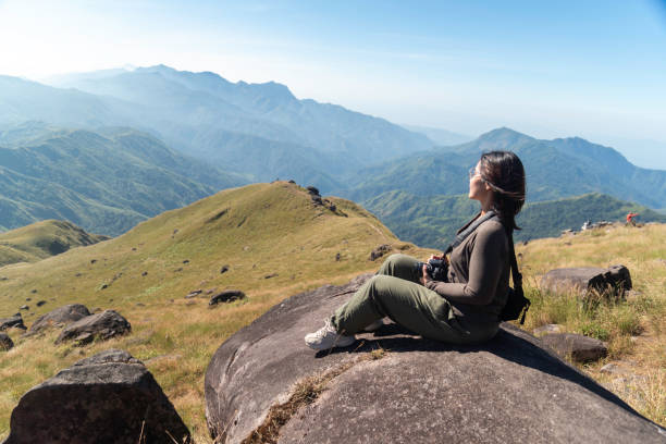 istock Hiker asian backpack walking trail activity camping outdoors and People exploring forest green natural capturing beauty nature outdoor. 2192754132