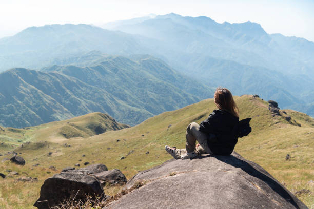istock Hiker asian backpack walking trail activity camping outdoors and People exploring forest green natural capturing beauty nature outdoor. 2192754266