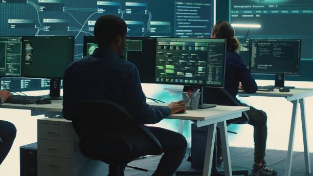 istock Cyber intelligence team of experts in a governmental hacking room 2192754283
