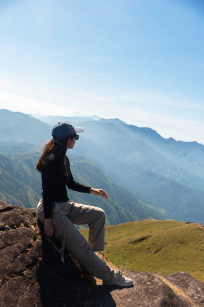 istock Hiker asian backpack walking trail activity camping outdoors and People exploring forest green natural capturing beauty nature outdoor. 2192754493