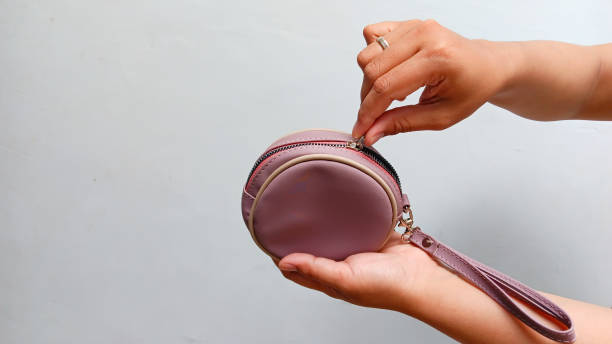 istock Hand taking money in a small wallet 2192755281
