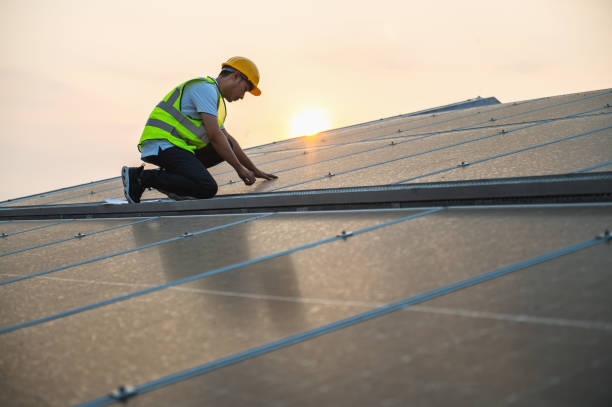 istock man in a yellow vest is working on a solar panel 2192755551
