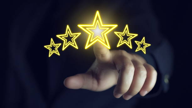 istock Businessman points finger with glowing five stars for customer excellent satisfaction and product service evaluation award concept. 2192755581