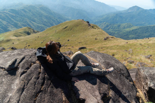 istock Hiker asian backpack walking trail activity camping outdoors and People exploring forest green natural capturing beauty nature outdoor. 2192755620