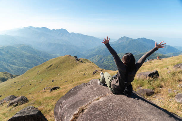 istock Hiker asian backpack walking trail activity camping outdoors and People exploring forest green natural capturing beauty nature outdoor. 2192755631