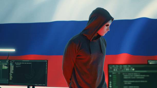 istock Russian hacker in a governmental IT environment with a russian flag 2192756101