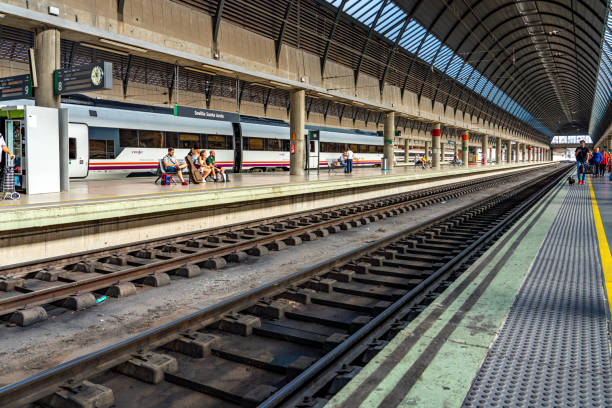 Tourist are waiting the train. Seville Santa Justa Train Station view, Spain.